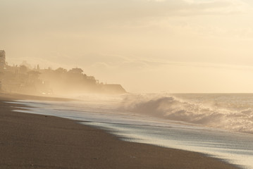Fototapeta premium Sun Rays & Mist During Sunrise, Letojanni beach, Sicily