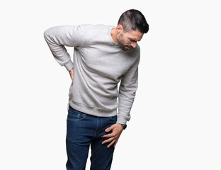 Young handsome man wearing sweatshirt over isolated background Suffering of backache, touching back with hand, muscular pain