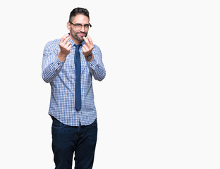 Young business man wearing glasses over isolated background Doing money gesture with hand, asking...