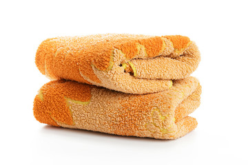 two orange towels stacked on a white background