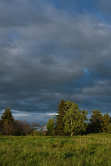 Dramatic sunset on the summer field.