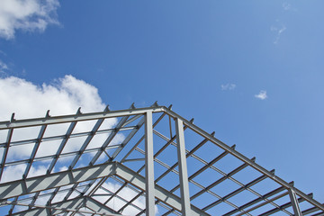 The structure of the building. Steel construction on the sky background. Electroplate steel metal....