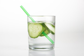 Fototapeta na wymiar Cucumber water, cleansing water to detoxify the body and quench thirst on a white background.