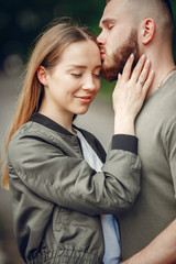 Couple in a forest. Man in a green t-shirt