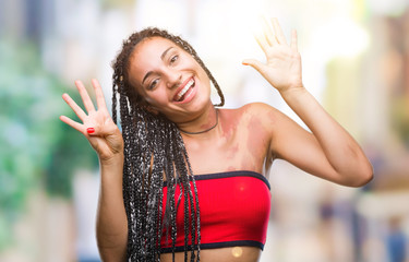 Young braided hair african american with pigmentation blemish birth mark over isolated background...