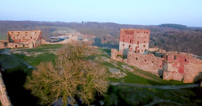 Aerial drone push in shot flying towards the Hammershus Castle Ruins in Scandinavia, Hammeren, Bornholm Island, Denmark