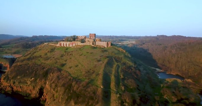 Aerial drone parallax tracking left shot flying towards the Hammershus Castle Ruins in Scandinavia, Hammeren, Bornholm Island, Denmark
