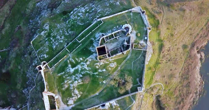 Aerial drone bird's eye downwards rotating shot shot flying towards the Hammershus Castle Ruins in Scandinavia, Hammeren, Bornholm Island, Denmark