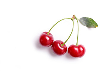 Ripe red cherries isolated on white background