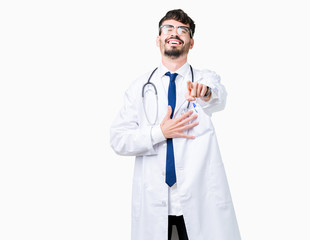 Young doctor man wearing hospital coat over isolated background Laughing of you, pointing to the camera with finger hand over chest, shame expression