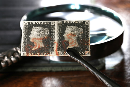 Horizontal pair of plate 1b Penny Black with red Maltese cross cancellation. It is the world's first adhesive postage stamp.