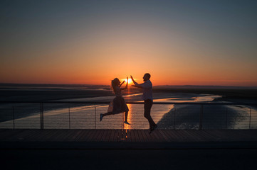 Fototapeta na wymiar boy and girl run towards each other in the morning when the sun rises