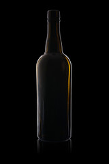 Empty bottle from dark glass isolated on a black background with reflection