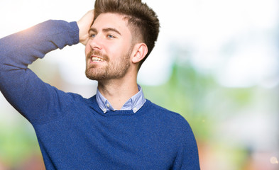 Young handsome bussines man Smiling confident touching hair with hand up gesture, posing attractive