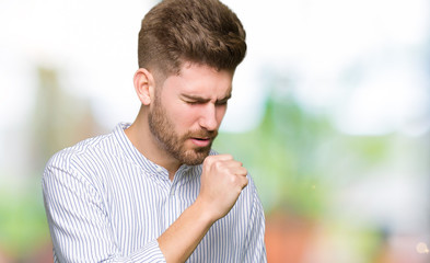 Young handsome man feeling unwell and coughing as symptom for cold or bronchitis. Healthcare...