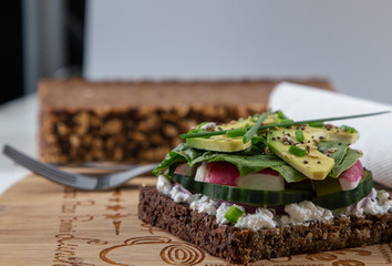 Fresh  vegetarian sandwich with greens and avocado