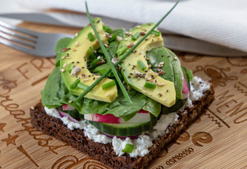 Fresh  vegetarian sandwich with greens and avocado