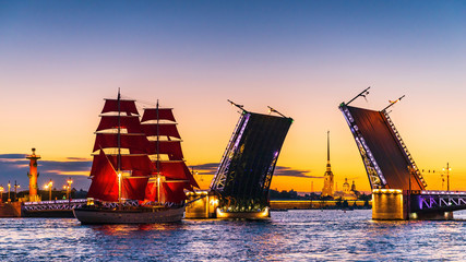 Ship with red sails sails on the Neva. Preparation for the holiday of all schoolchildren "Scarlet Sails" in St. Petersburg
