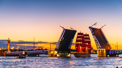 Ship with red sails sails on the Neva. Preparation for the holiday of all schoolchildren "Scarlet Sails" in St. Petersburg