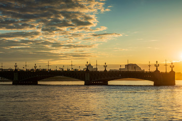 St. Petersburg beautiful cityscape at sunrise. Trinity Bridge in the rays of dawn.