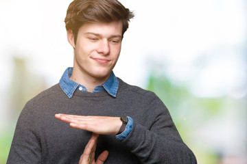 Young handsome elegant man over isolated background Doing time out gesture with hands, frustrated...