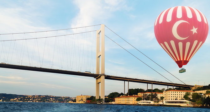 Hot Air Balloon Flying Bosphorus bridge Istanbul Turkey.