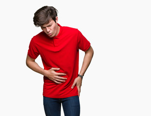 Young handsome man wearing red t-shirt over isolated background with hand on stomach because nausea, painful disease feeling unwell. Ache concept.