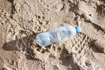 Plastic water bottle on a beach