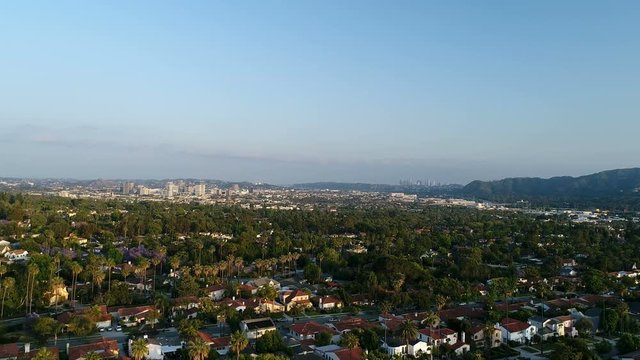 Wealthy neighborhood with downtown Glendale and Los Angeles in the distance - 4K UHD