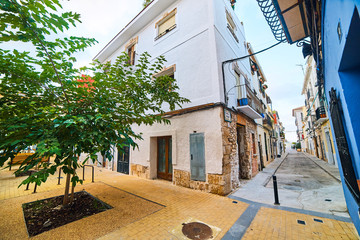 DENIA, SPAIN - JUNE 13, 2019: Old town of Denia with narrow streets and pavement