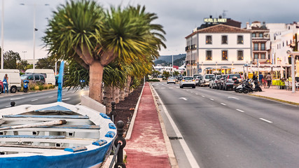 Obraz premium DENIA, SPAIN - JUNE 13, 2019: Spanish town Denia with beautiful street and palms.