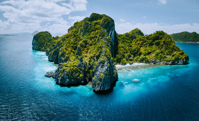 Aerial panorama of tropical paradise Entalula Island and clear blue water El Nido, Palawan,...