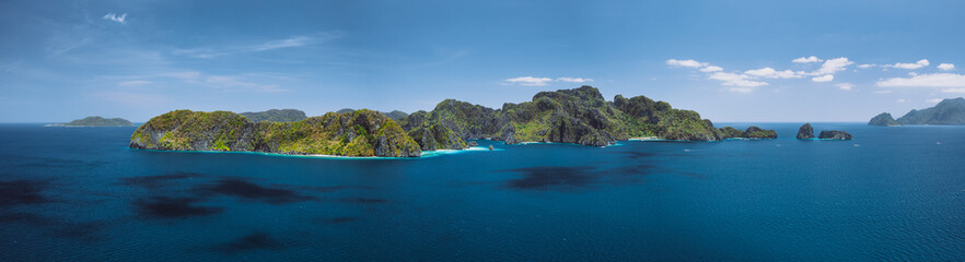 Fototapeta premium Breathtaking aerial panorama of tropical paradise Miniloc Island, El Nido, Palawan, Philippines. Most beautiful natural scenery Marine Reserve Park
