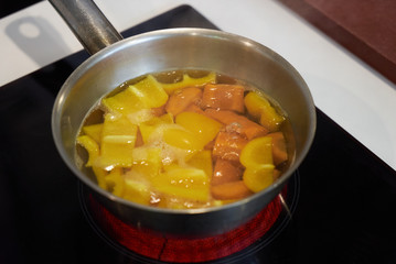 Bell pepper in boiling water. Cook sweet pepper, yellow paprika process