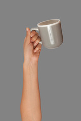 many hands raised up and holding coffee cups 