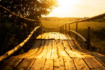 sunset over the old wooden bridge