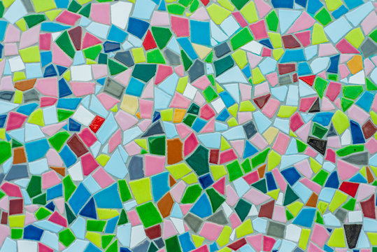 Colorful pastel vivid colour and various geometric shape and size of mosaic tile with random pattern.