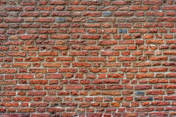 Real vintage Bumpy, rough and old brick texture with imperfect, dilapidate, impair , corroded and defective flemish brick bond pattern.