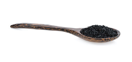sesame seed in wood spoon isolated on white background