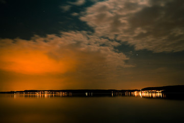 Fototapeta na wymiar Lake Konstanz at midnight with long exposure and amazing night sky