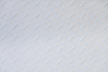 White metal diamond plate wall texture background.