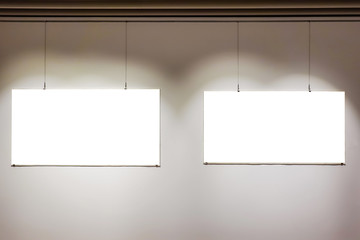 Two empty frames on wall in art gallery museum exhibit blank white isolated clipping path