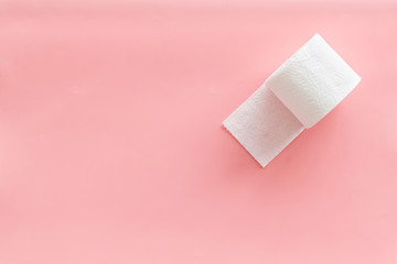 Toilet paper roll on pink background top view mock up