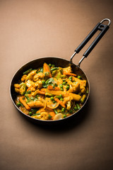 Mix vegetable curry - Indian main course recipe contains Carrots, cauliflower, green peas and beans, baby corn, capsicum and paneer/cottage cheese with traditional masala and curry, selective focus