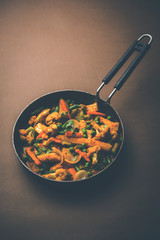 Mix vegetable curry - Indian main course recipe contains Carrots, cauliflower, green peas and beans, baby corn, capsicum and paneer/cottage cheese with traditional masala and curry, selective focus