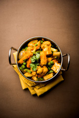 Mix vegetable curry - Indian main course recipe contains Carrots, cauliflower, green peas and beans, baby corn, capsicum and paneer/cottage cheese with traditional masala and curry, selective focus