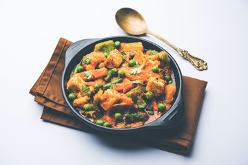 Mix vegetable curry - Indian main course recipe contains Carrots, cauliflower, green peas and beans, baby corn, capsicum and paneer/cottage cheese with traditional masala and curry, selective focus