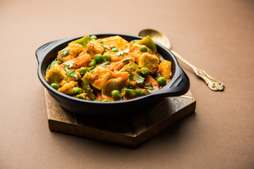 Mix vegetable curry - Indian main course recipe contains Carrots, cauliflower, green peas and beans, baby corn, capsicum and paneer/cottage cheese with traditional masala and curry, selective focus