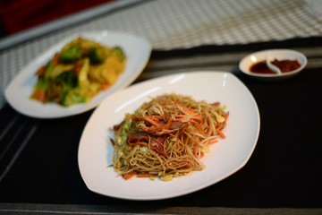 Chinese fried noodle, setup nicely on table ready to serve