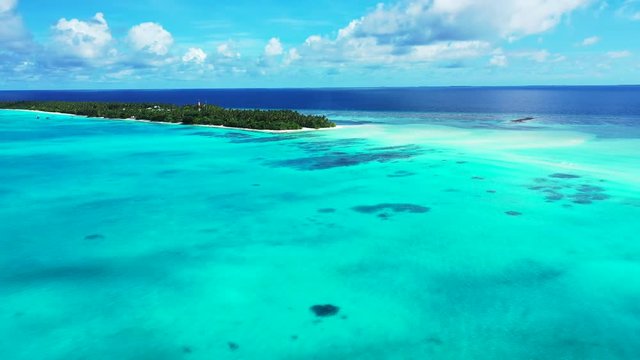Aerial View Of Tupai Heart Island Coral Reef Atoll In French Polynesia dolly out drone shot